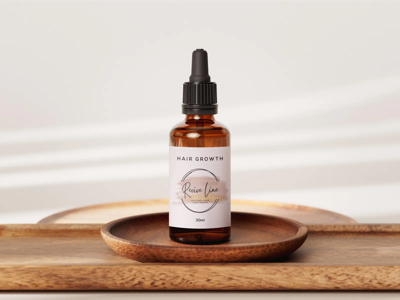 ReviveLine hair growth oil 30ml on wooden tray - South African hair regrowth brand